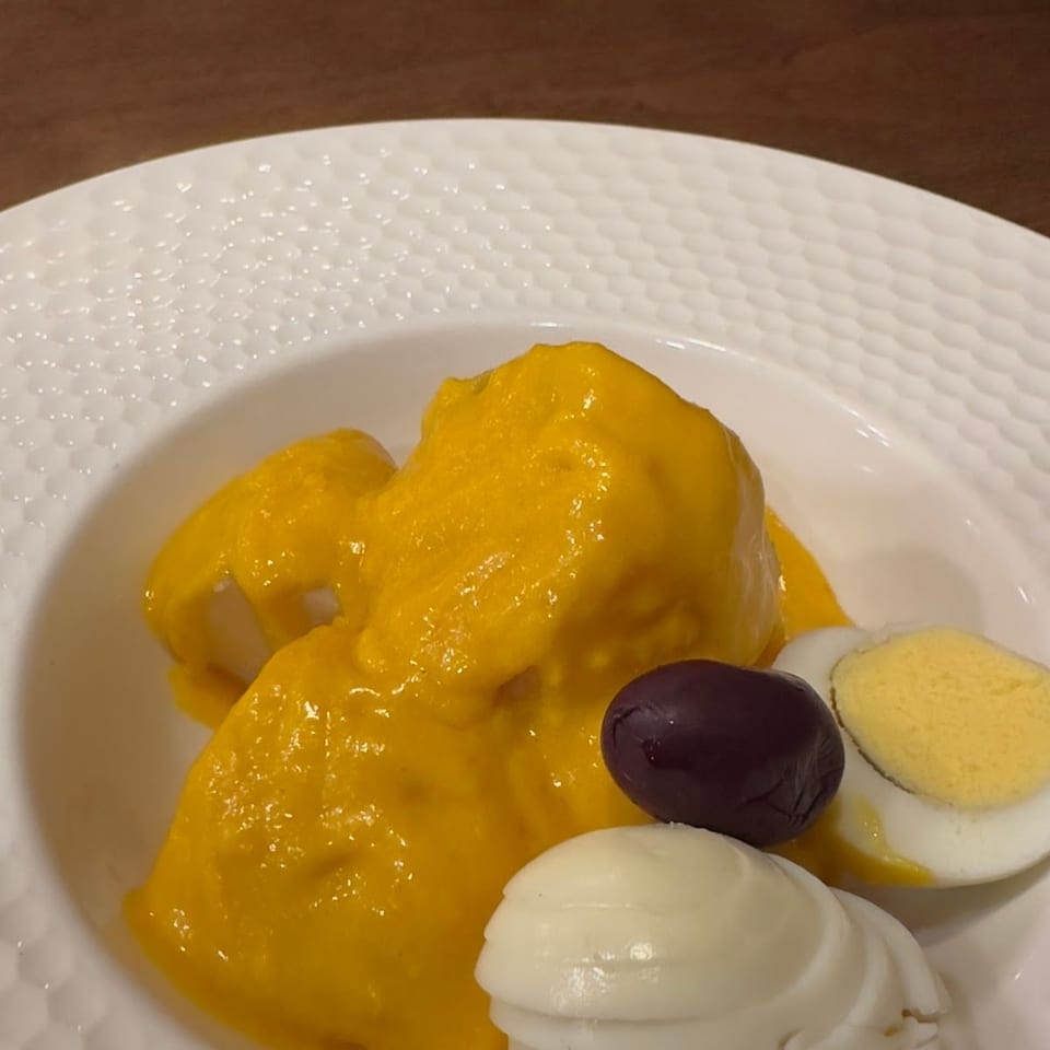 Ají de gallina with egg and olive