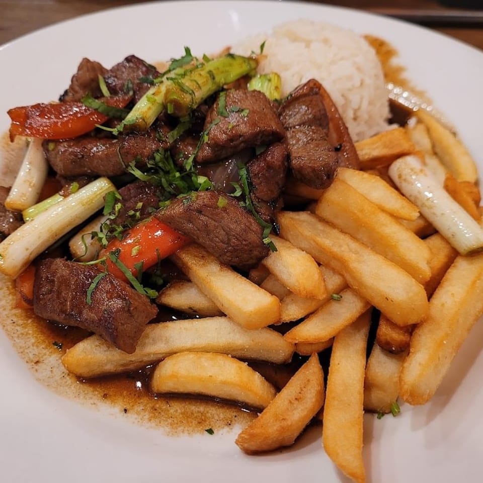 Lomo saltado with fries and white rice