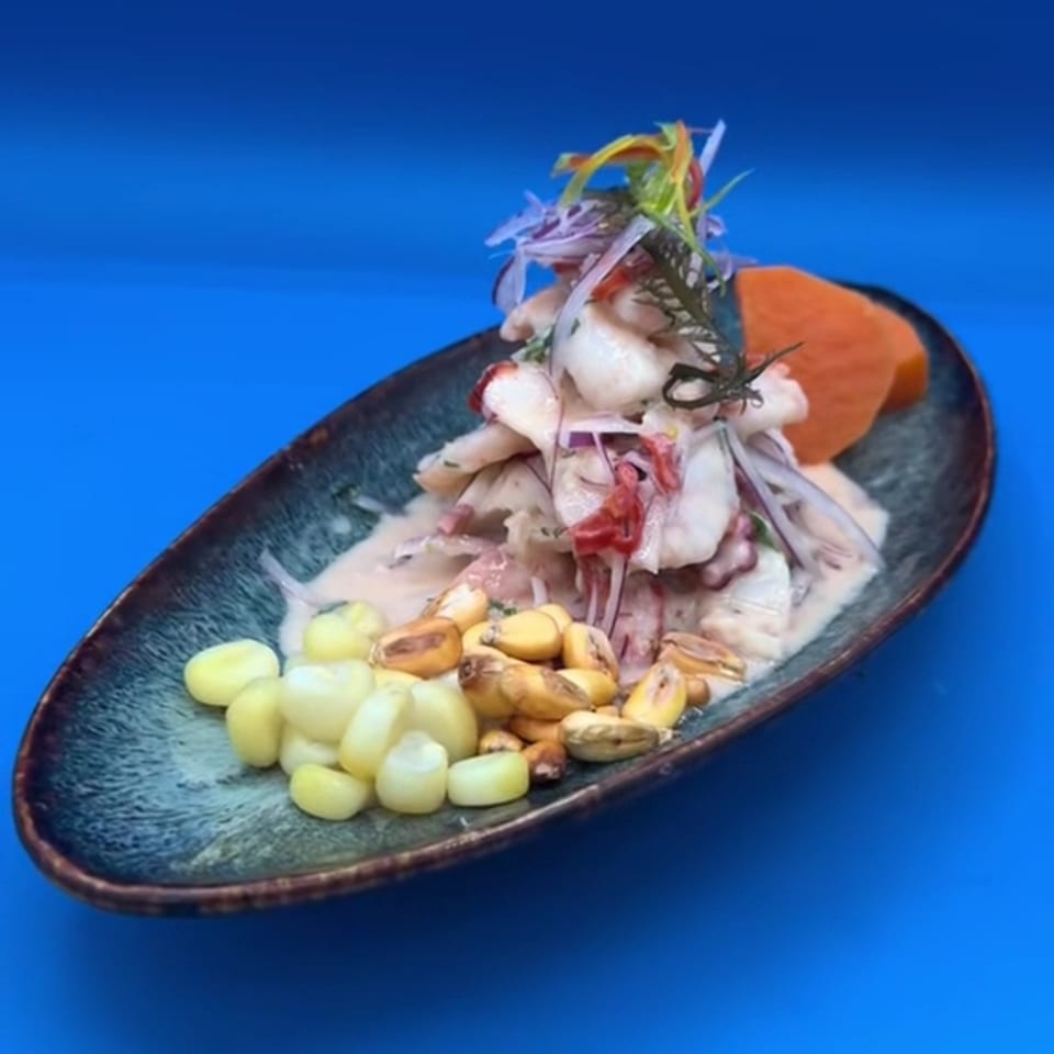 Ceviche with corn, red onion and herbs